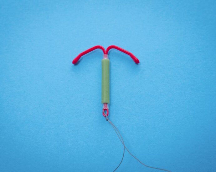An IUD against a blue background